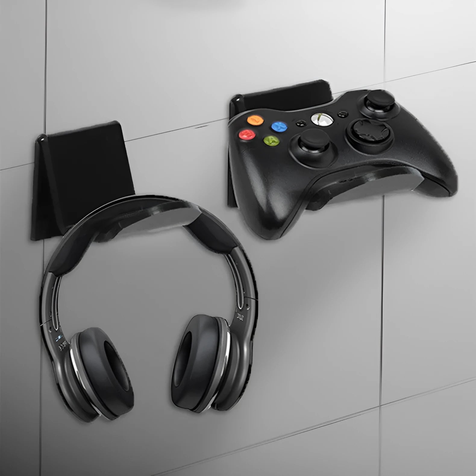 Plastic wall mounting bracket for video game controllers in black, white, or transparent finish.