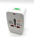 Compact universal travel adapter plug on a white background showing its size and socket.