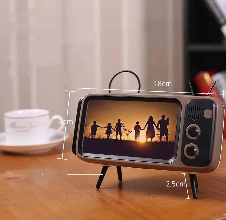 Retro TV mini portable Bluetooth speaker in blue with circular grille and compact 18x8x2.5cm size on a wooden desk