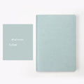 A5 dot grid notebook with soft blue imitation leather cover and locking plastic binding
