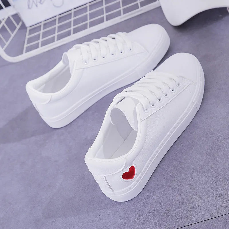 Women's PU leather heart pattern flat shoes in white red colour with non-slip rubber sole