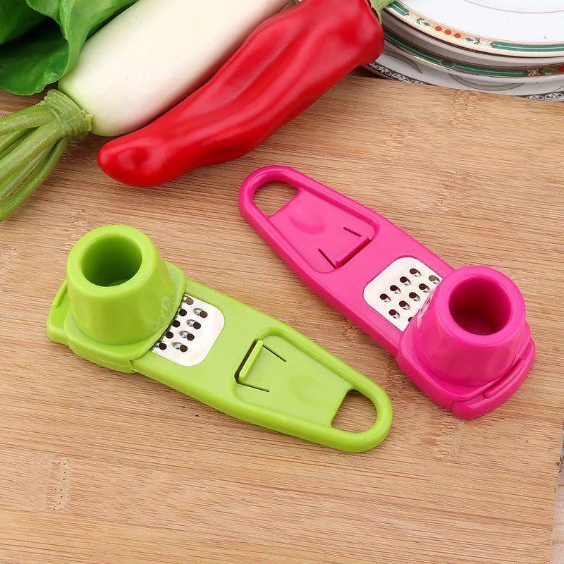 Eco-friendly garlic masher and seasoning grinder in rose red and light green