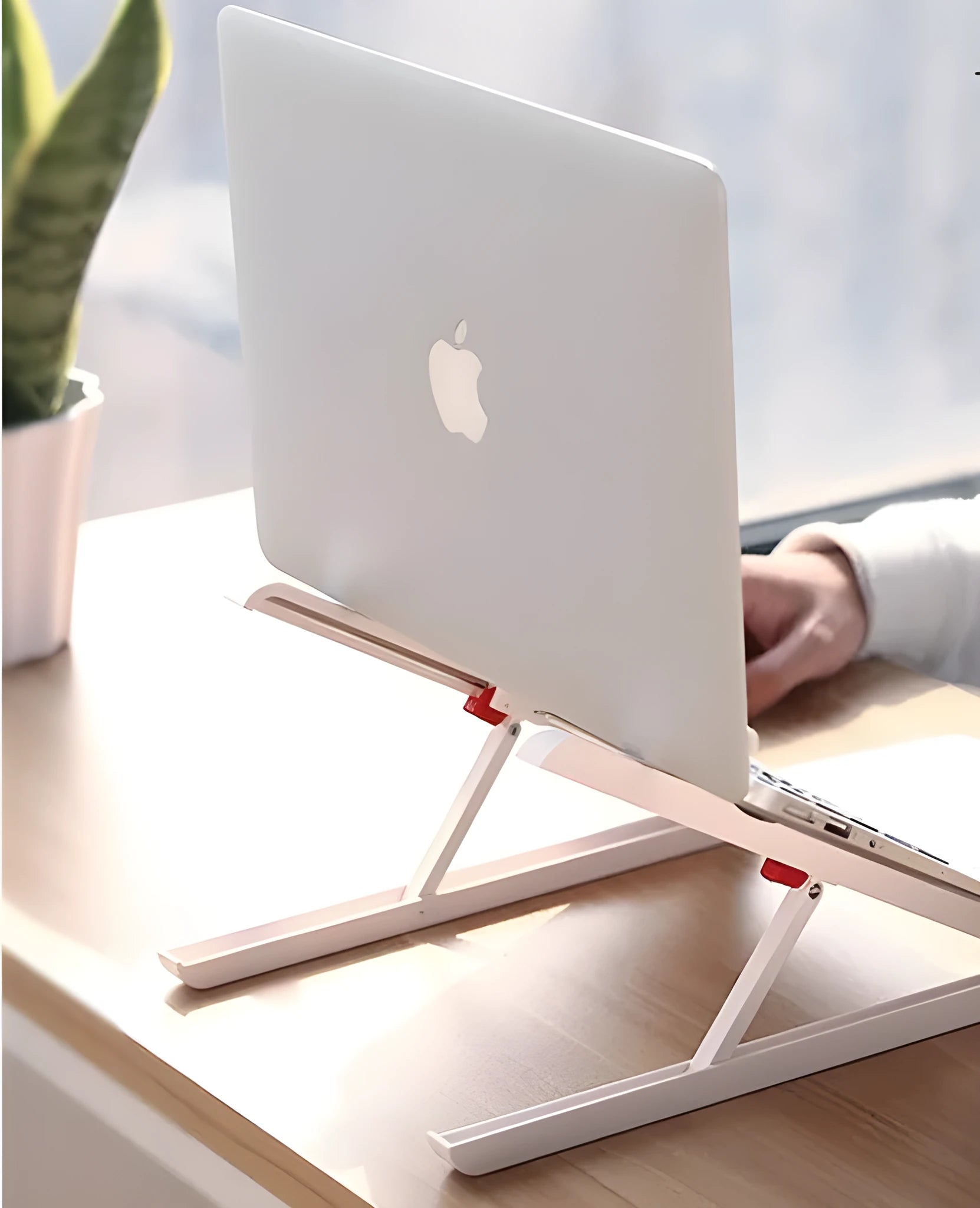 White portable laptop cooling stand with adjustable height and folding mechanism