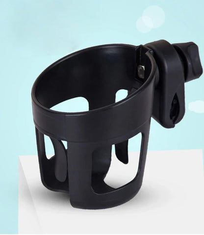 Universal baby stroller cup holder with phone pocket attached to a stroller