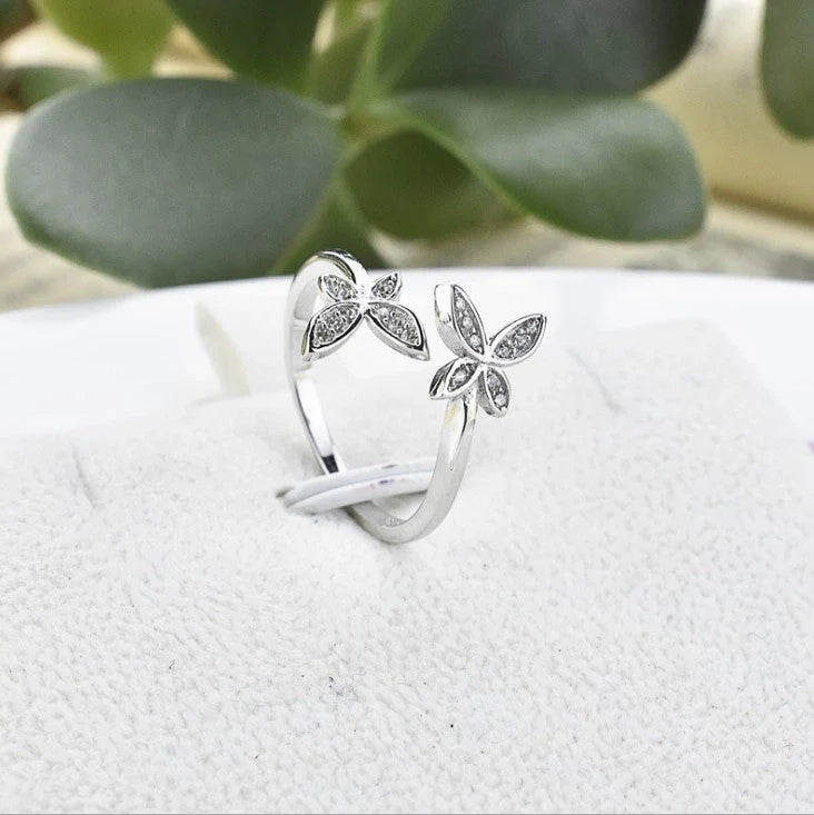 Adjustable sterling silver butterfly ring with sparkling gem settings
