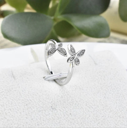 Adjustable sterling silver butterfly ring with sparkling gem settings