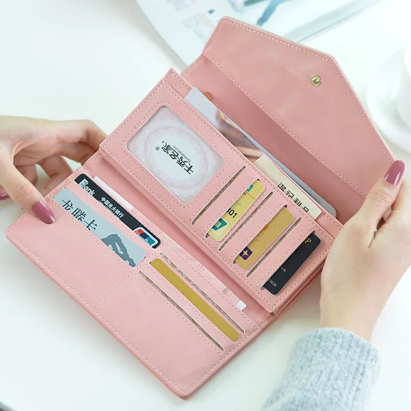Large three-fold women's wallet with buckle and coin purse in black, blue, green, melon red, violet.
