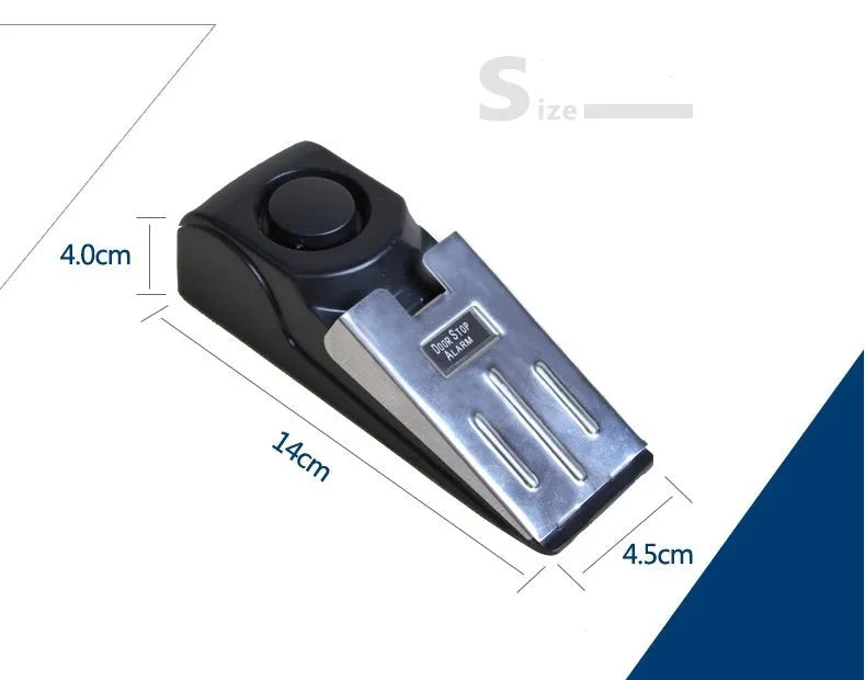 Black wedge-shaped door alarm with stainless steel cover and sensitivity controls