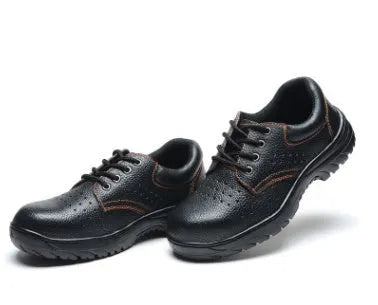 Black embossed cowhide safety shoes with steel toe cap and antiskid outsole on concrete floor