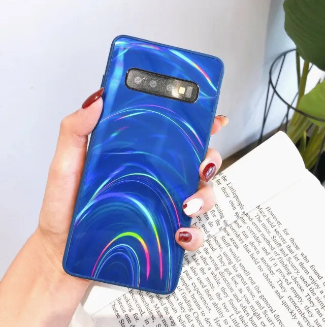 Marble pattern silicone phone case for Samsung Galaxy smartphone on a table.