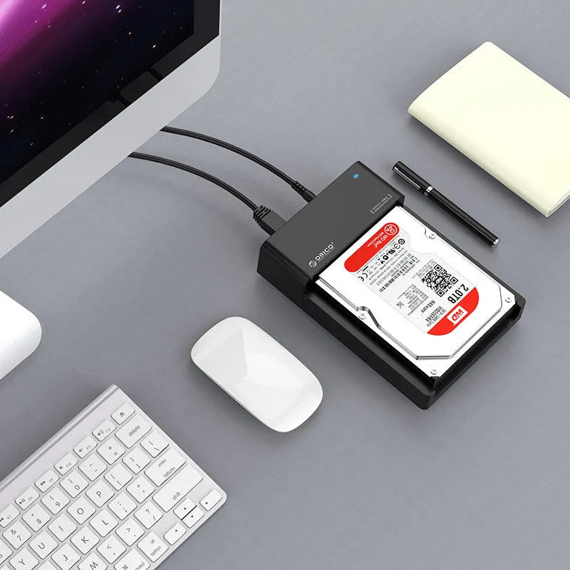 Black universal SATA hard drive enclosure for 2.5 and 3.5 inch drives with data cable