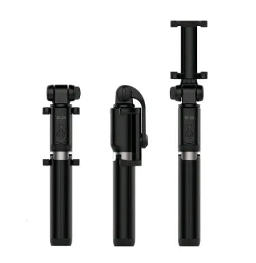 Aluminium telescopic Bluetooth selfie stick with tripod base and remote control next to a smartphone.
