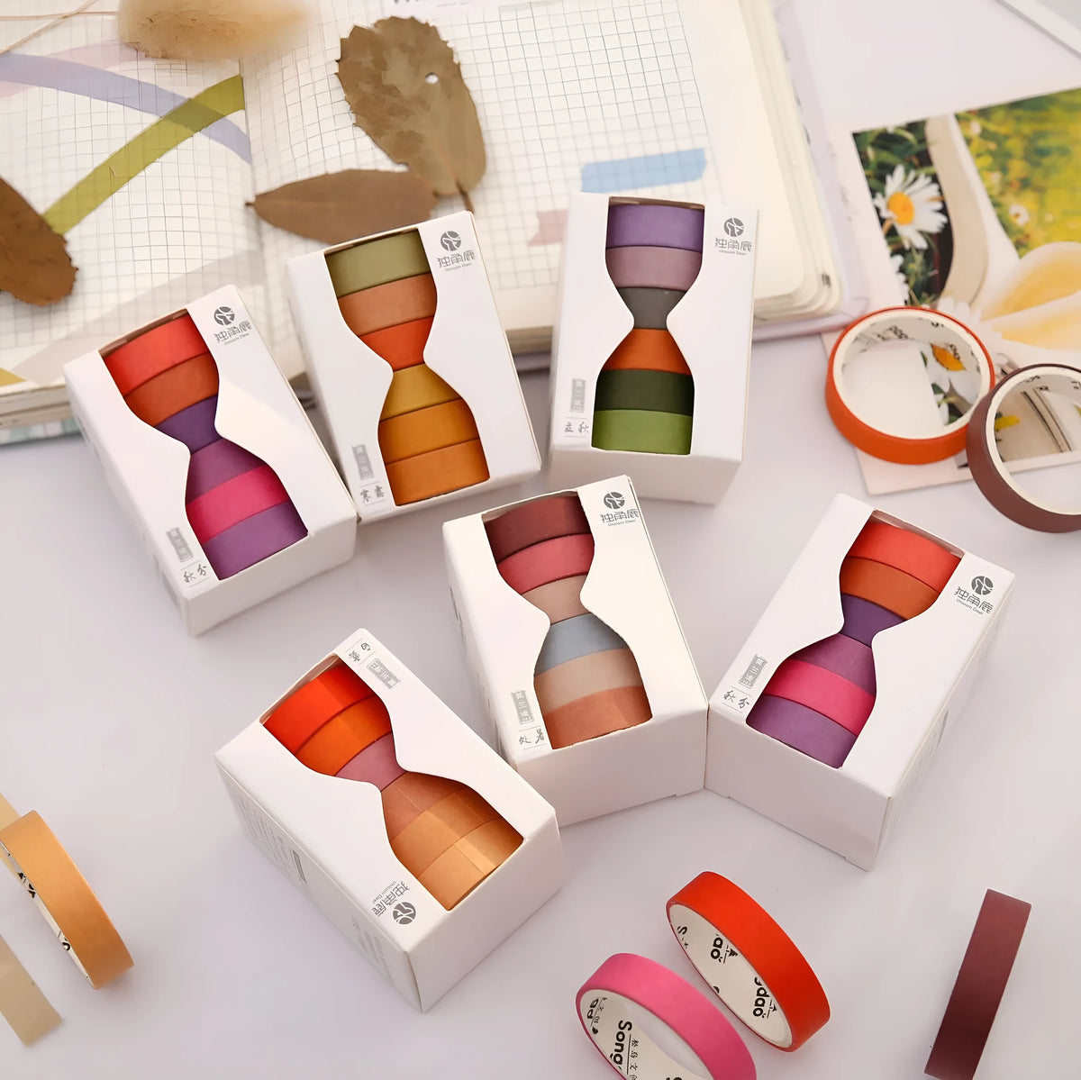 Morandi Japanese paper tape six rolls 9mm x 3m in assorted colours on craft background