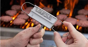 Silver aluminium alloy BBQ branding iron with 55 letters and 8 spaces for personalised meat stamping on a wooden surface