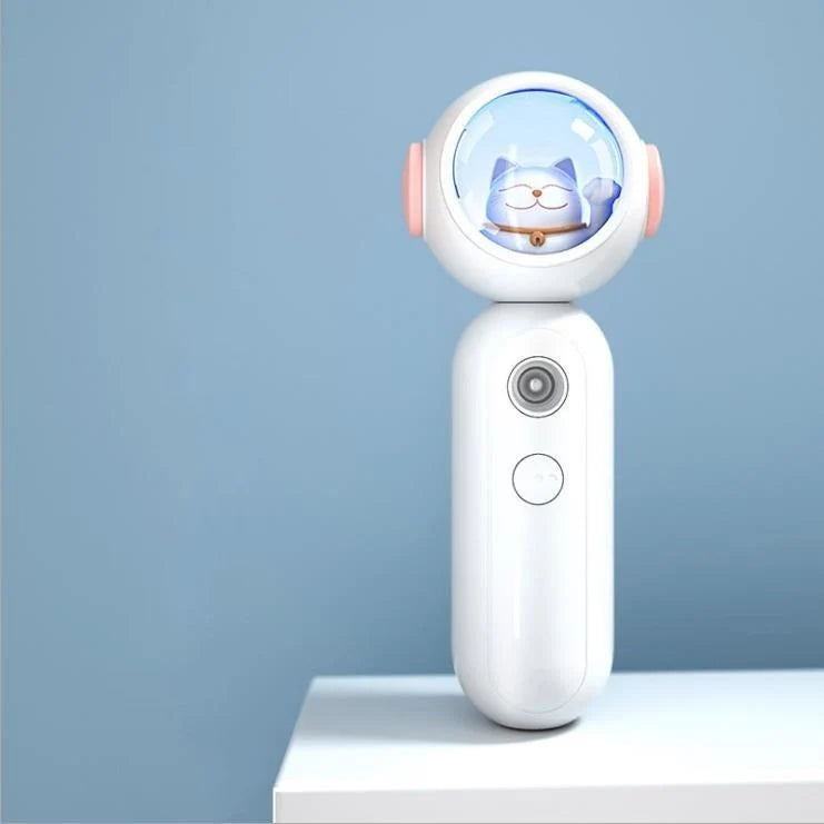 Handheld nano spray steamer in cat pink, cat white, and alien red for skin hydration