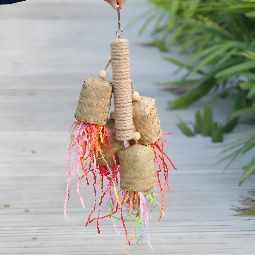 Colourful shredded paper parrot biting toy with wood beads and sisal rope, measuring 15 by 35 cm