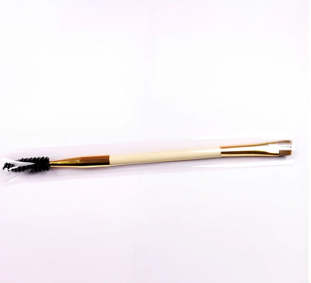 Double-ended eyebrow brush with bamboo handle and golden tube, rayon bristles for precise application and spiral head for blending brows and lashes