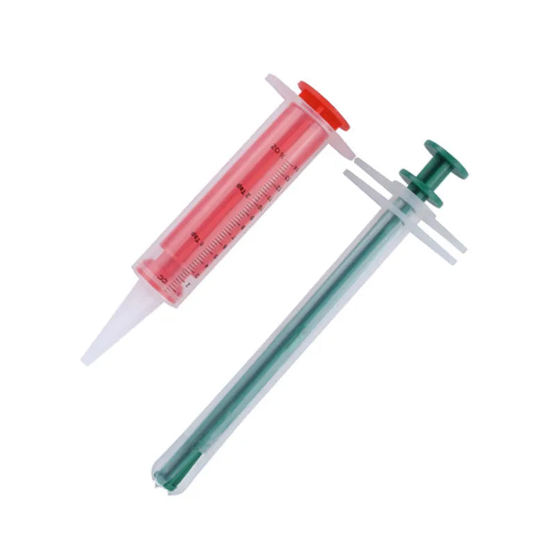 Two pet pill shooters with soft silicone tips in different sizes for administering tablets to cats and dogs