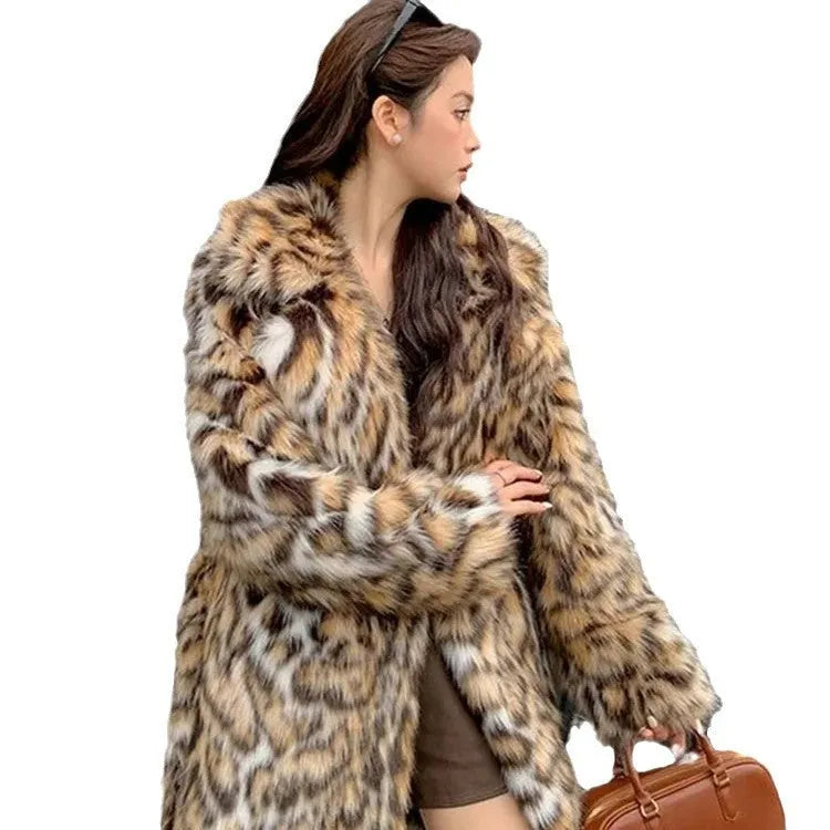 Faux fur street fashion coat with fur collar in long style with regular sleeves and pockets