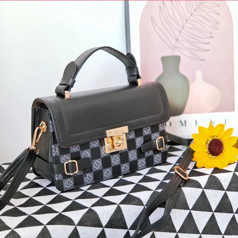 Small square retro patterned crossbody bag in PU leather with a file compartment inside.