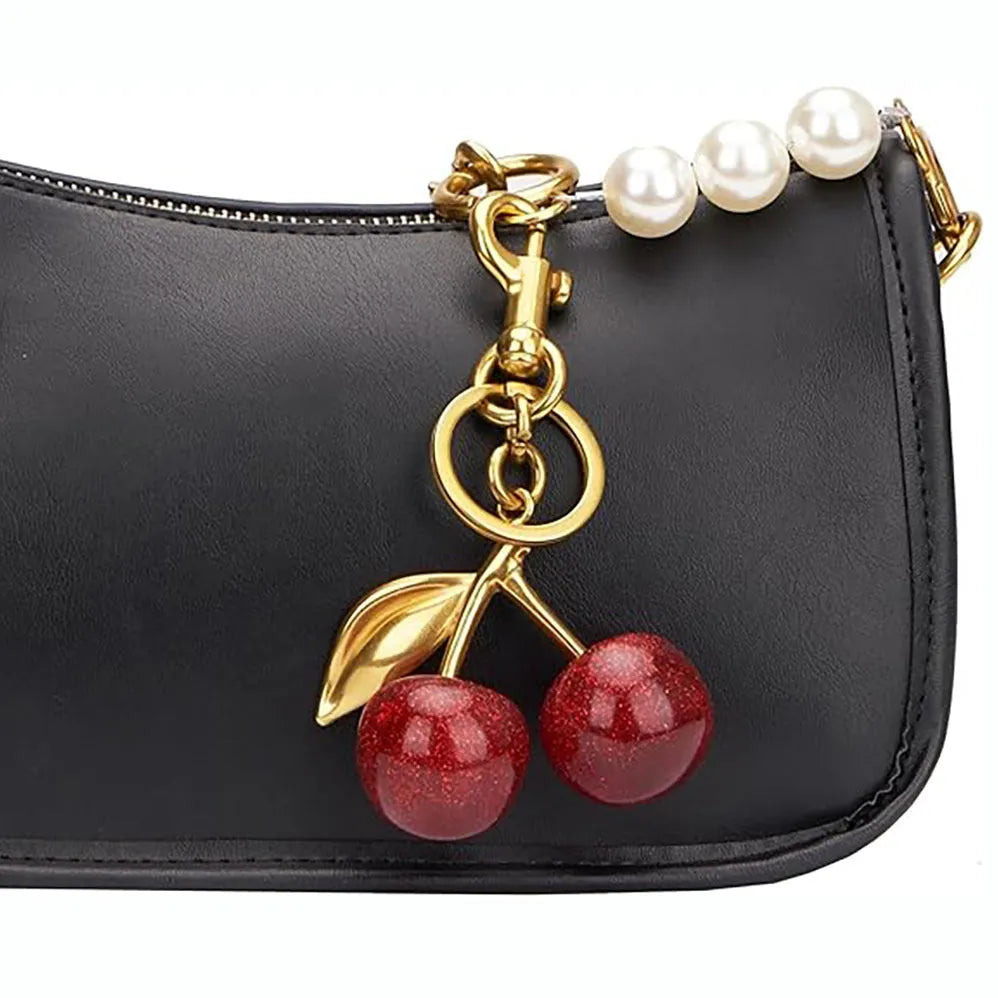 Red three-dimensional zinc alloy pendant for a keyring or women's bag.