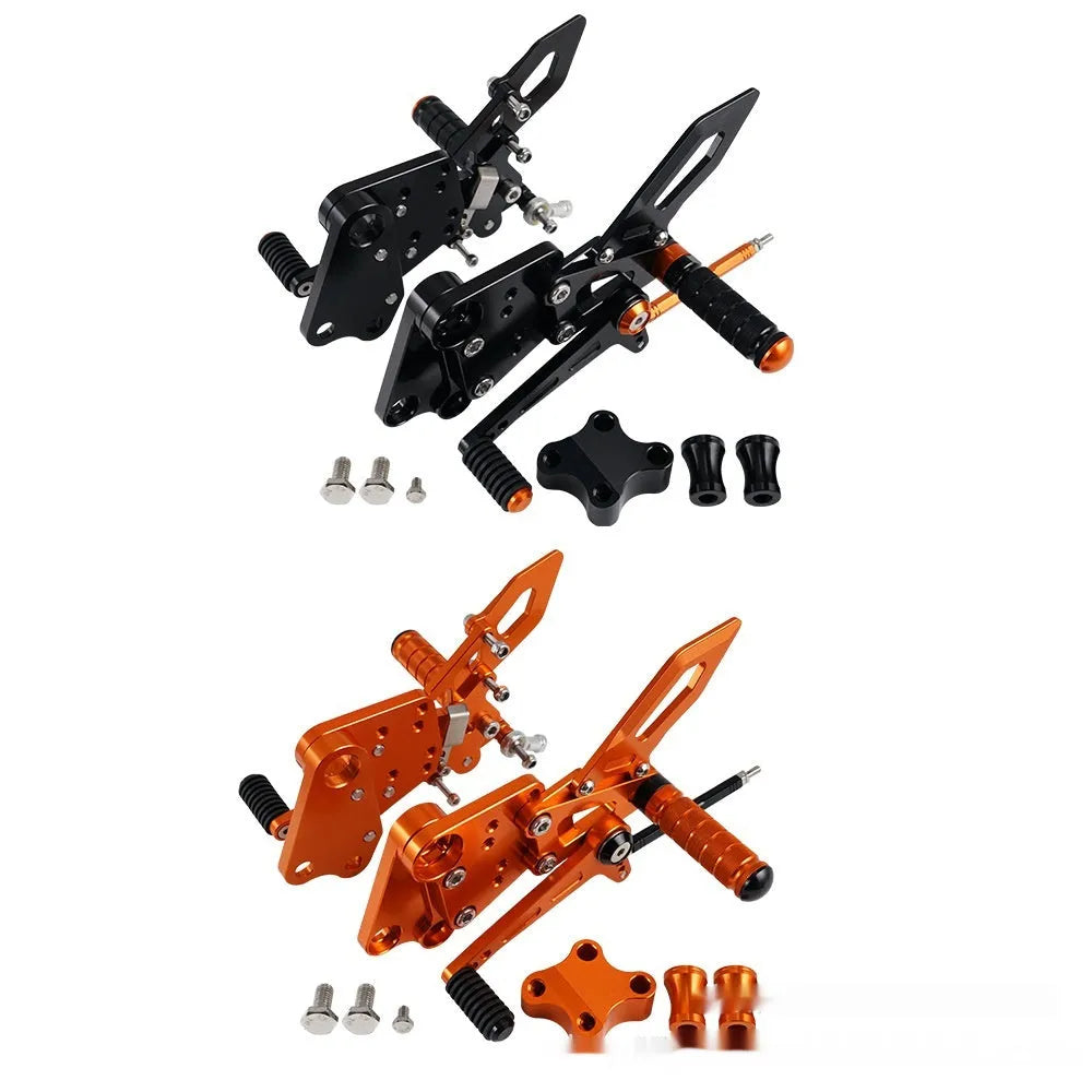KTM DUKE motorcycle raised footrest relocation kit in black and orange colours