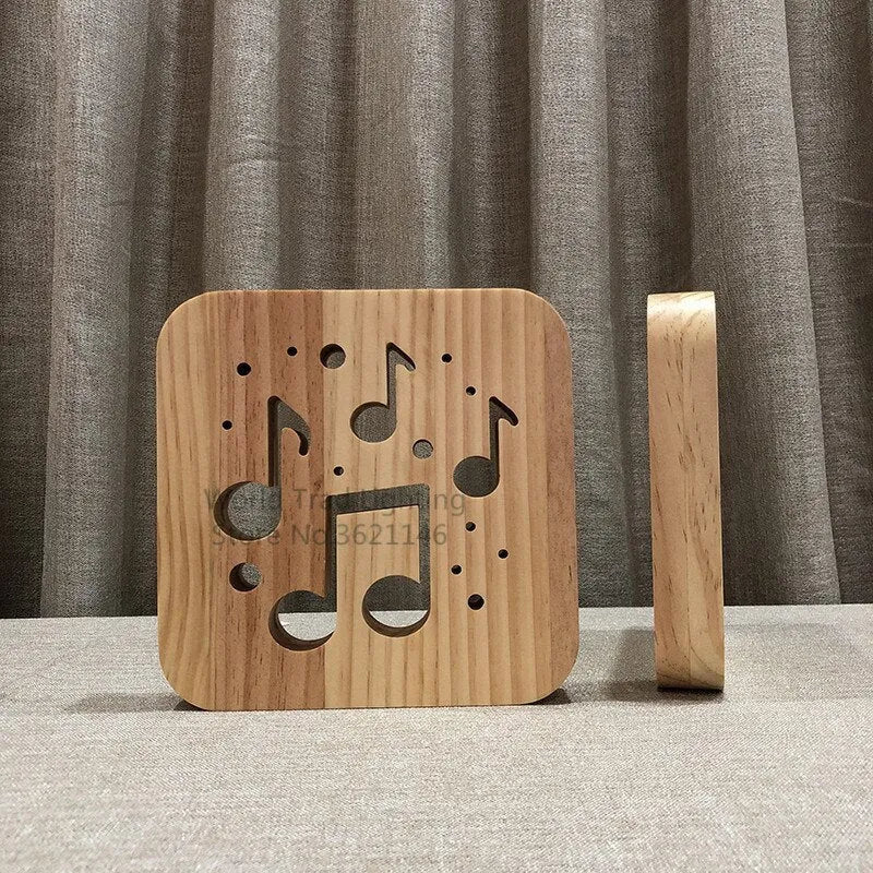 Square pine wood USB LED lamp emitting warm white light on a desk.