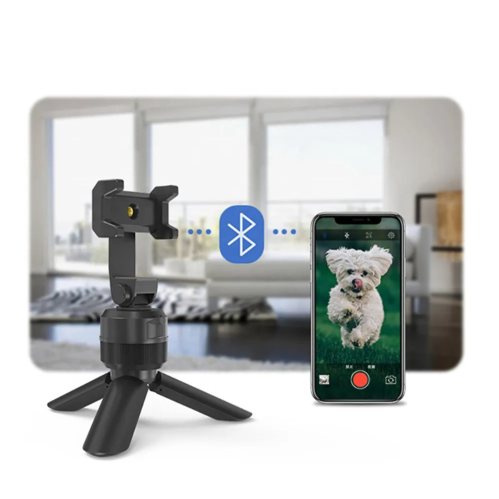 Black 360 degree rotating mobile phone holder on a desk, ABS construction with full rotation capability