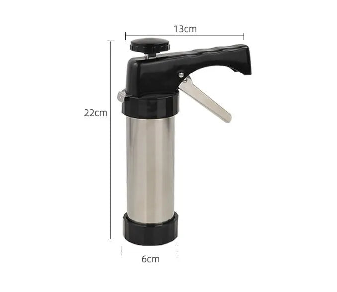 Stainless steel biscuit press gun with assorted cookie moulds and piping nozzles for baking.