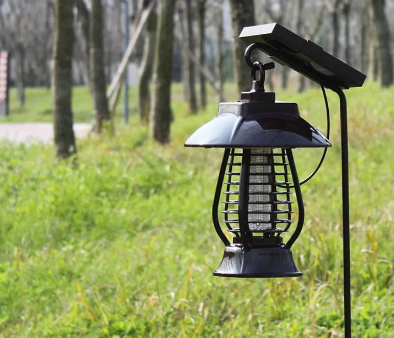 White solar mosquito lamp with purple switch and solar panel for garden insect control