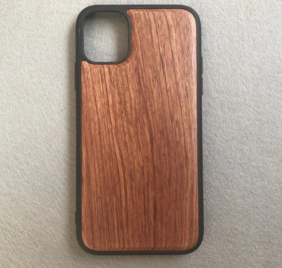 Wooden mobile phone case showing natural grain texture with iPhone 15 compatibility