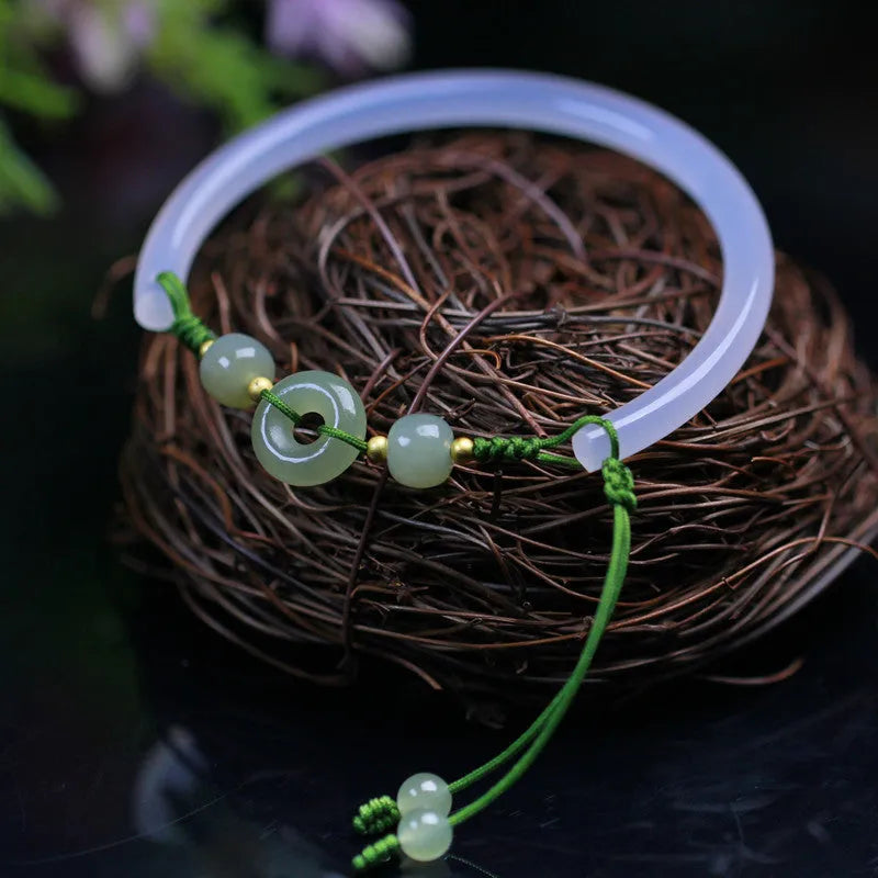 Hand-woven half bracelet with white agate and hetian jade beads and a peace buckle.