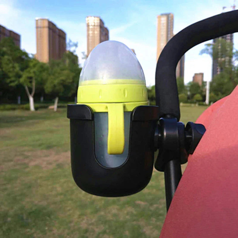 Universal baby stroller cup holder with phone pocket attached to a stroller