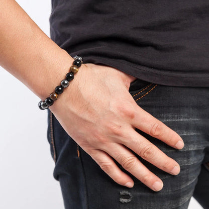 Hand-woven tiger eye stone bracelet in natural colours, showcasing unique texture and geometric design.