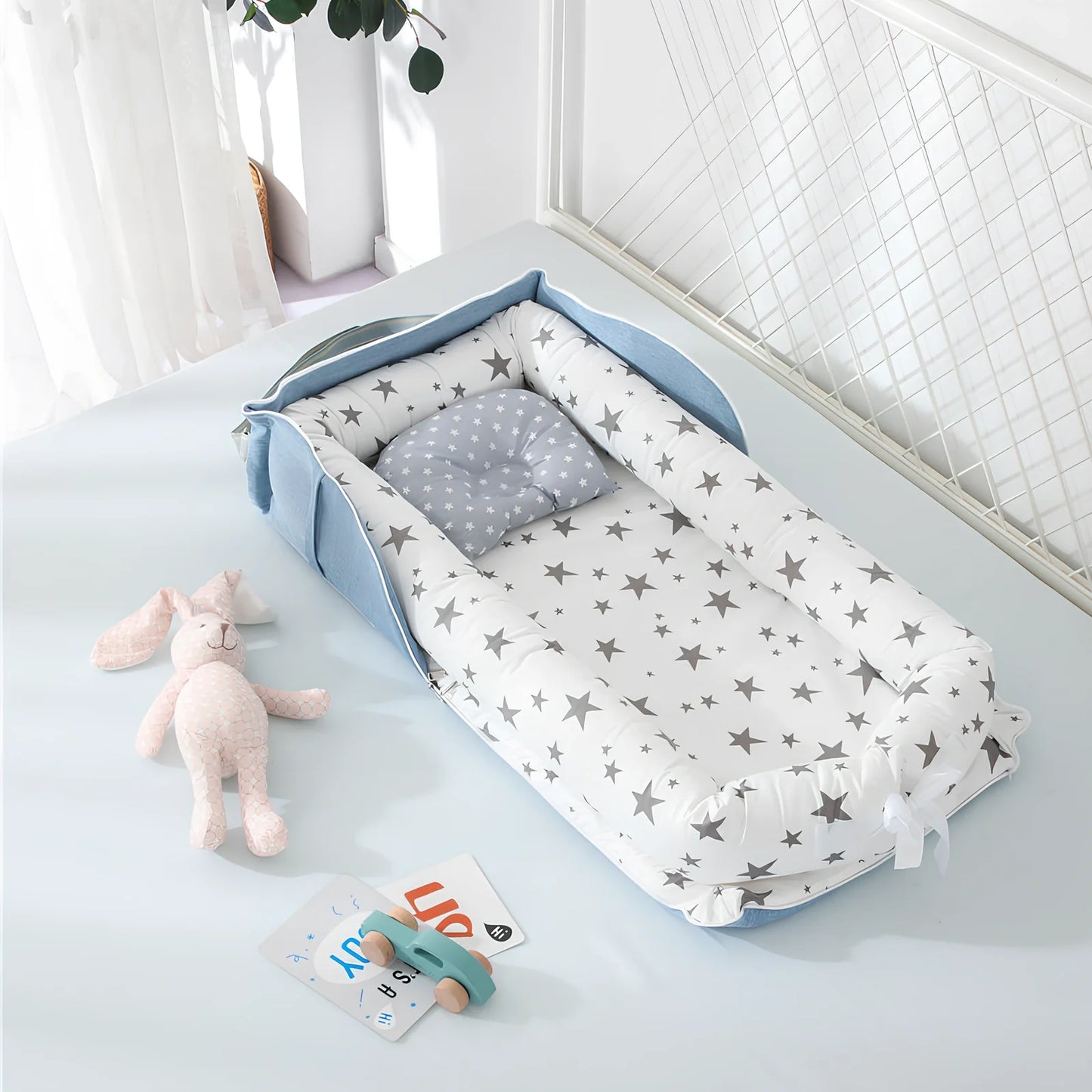 Foldable cotton portable baby crib in Animal World Blue, 90x50 cm with pillow and strap, weighing 1.3 kg