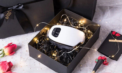 Bluetooth Music Eye Massager with air pressure and hot compress features in a compact leather case