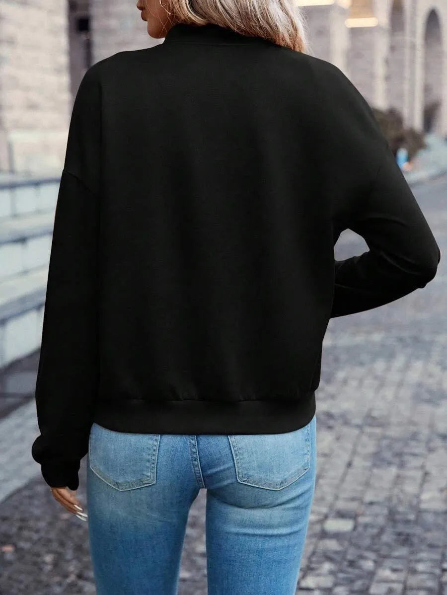 Solid black women's zip jacket with long sleeves and faux pocket details on front.