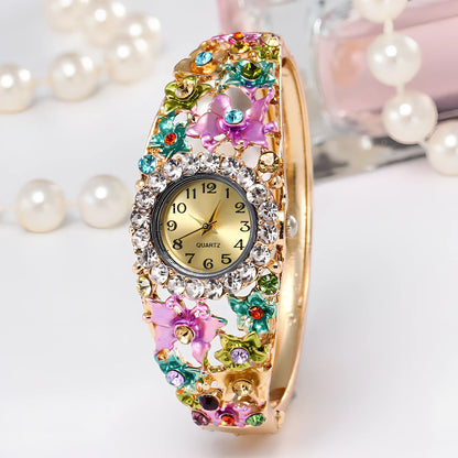 Small round flower diamond ladies bracelet watch, 20mm diameter, 10mm thick, alloy strap in gold colour with mineral glass mirror
