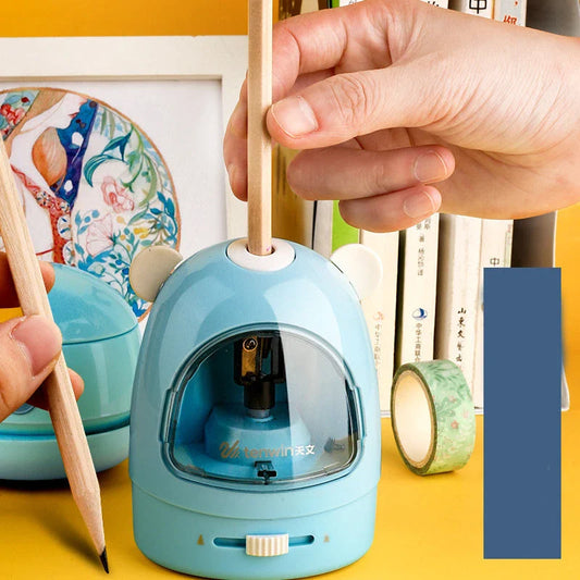 Electric pencil sharpener, eraser, and table vacuum cleaner set in blue