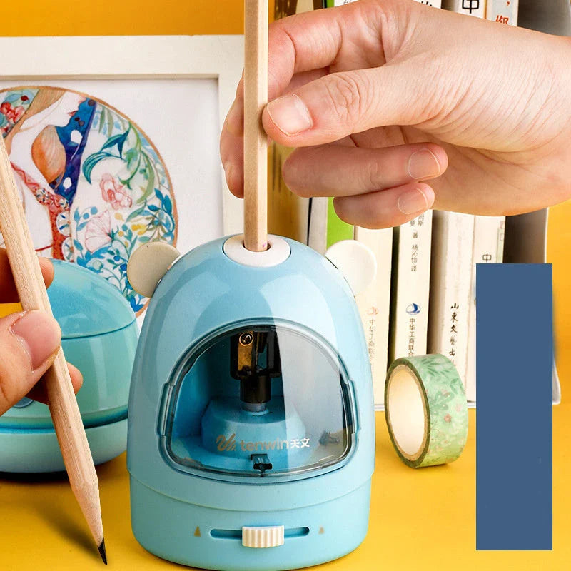 A 3-in-1 desktop organiser set including an electric vacuum cleaner, electric eraser, and electric pencil sharpener in a compact, blue design