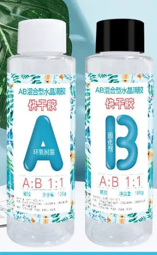 Two bottles of clear AB epoxy resin and hardener kit for DIY crafts, labelled 100g or 200g.