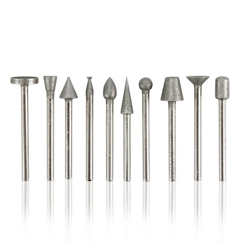 Set of alloy grinding heads with elliptical cone diamond and golden diamond tips on a white background.