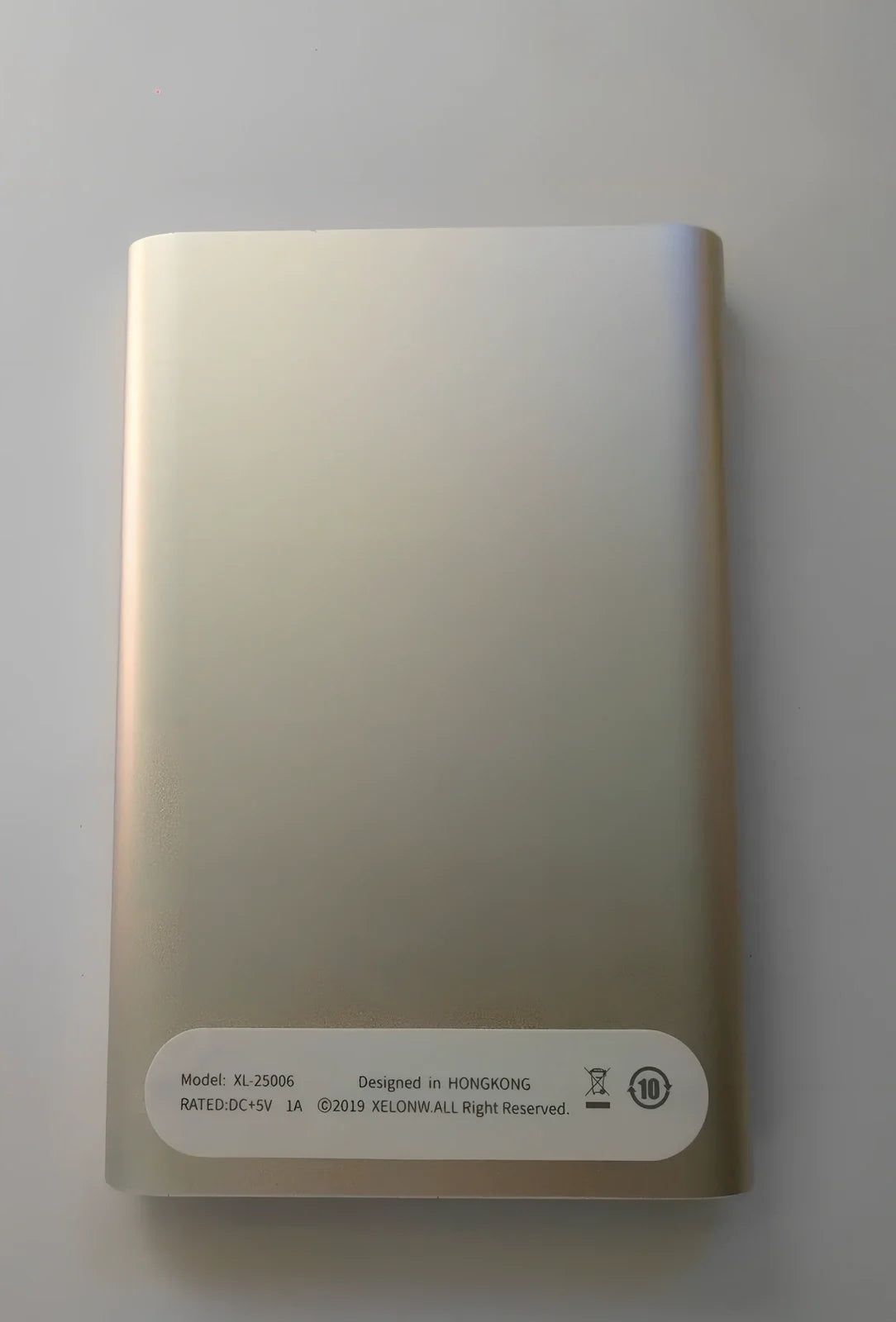 Black and silver 2.5-inch metal mobile hard drive with USB 3.0 connector showing activity light