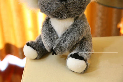 Soft plush koala doll with 100% PP cotton filling, available in 12cm, 16cm, 20cm, and 28cm sizes