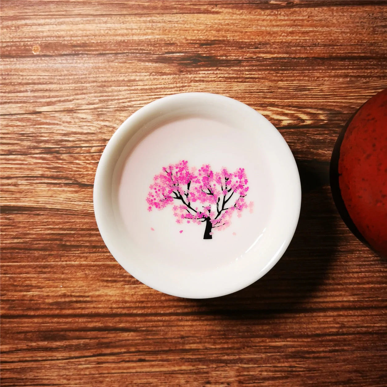 Magic Sakura Cup - Ceramic teacup with temperature-sensitive colour-changing sakura pattern