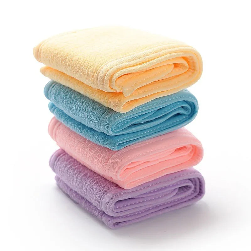 Thickened ant fabric beauty headband in white, pink, blue, purple, yellow on soft surface