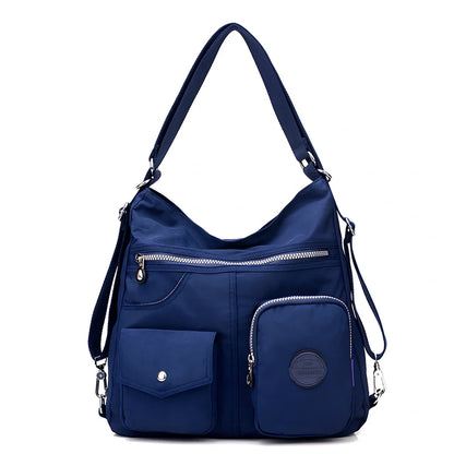 Women's waterproof nylon crossbody bag with organizational pockets and 34cm laptop capacity