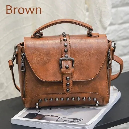 Vintage leather crossbody handbag with flap pocket and rivet detail in brown, size 25x20x12cm