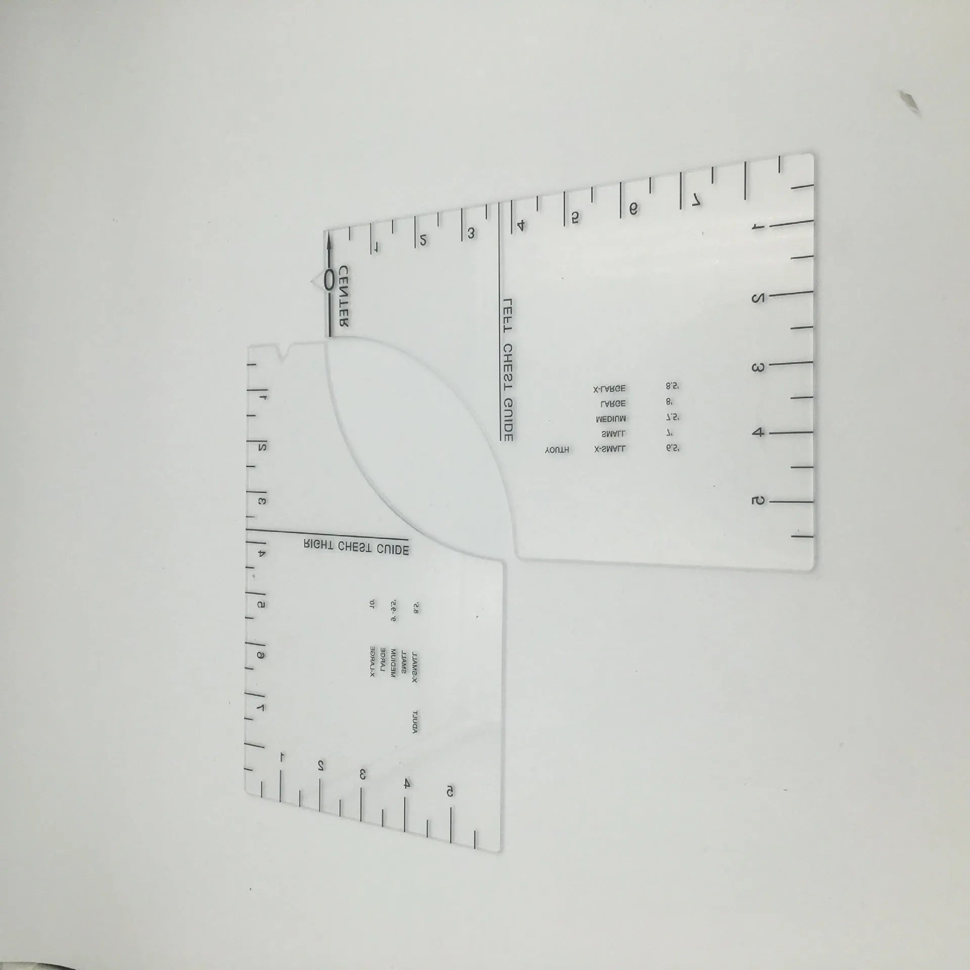 Transparent acrylic sewing ruler patch for T-shirt alignment, 10x6 inches.