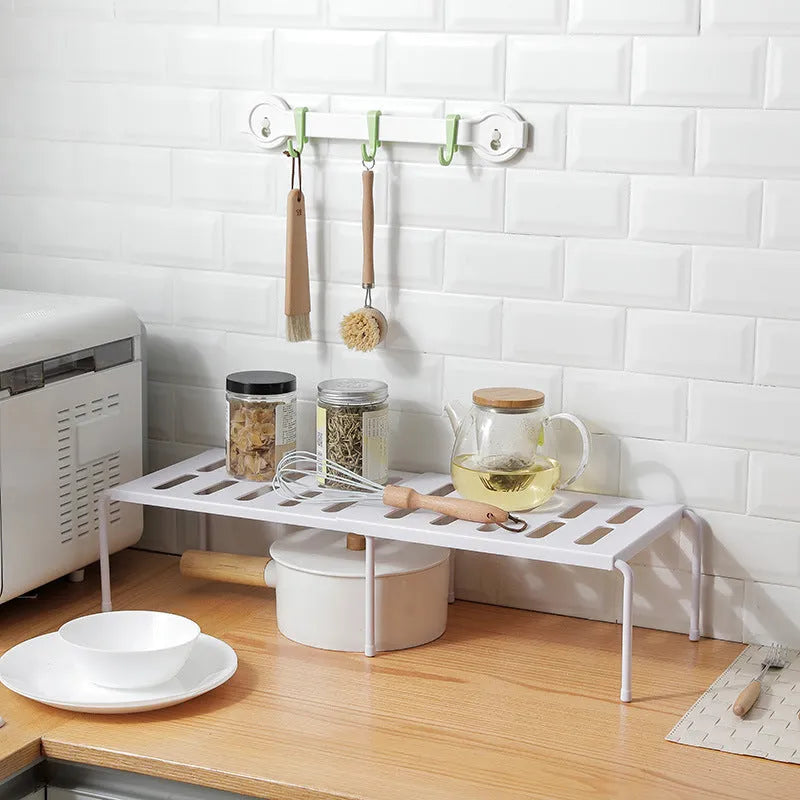 White telescopic plastic kitchen rack at extended height with ground installation